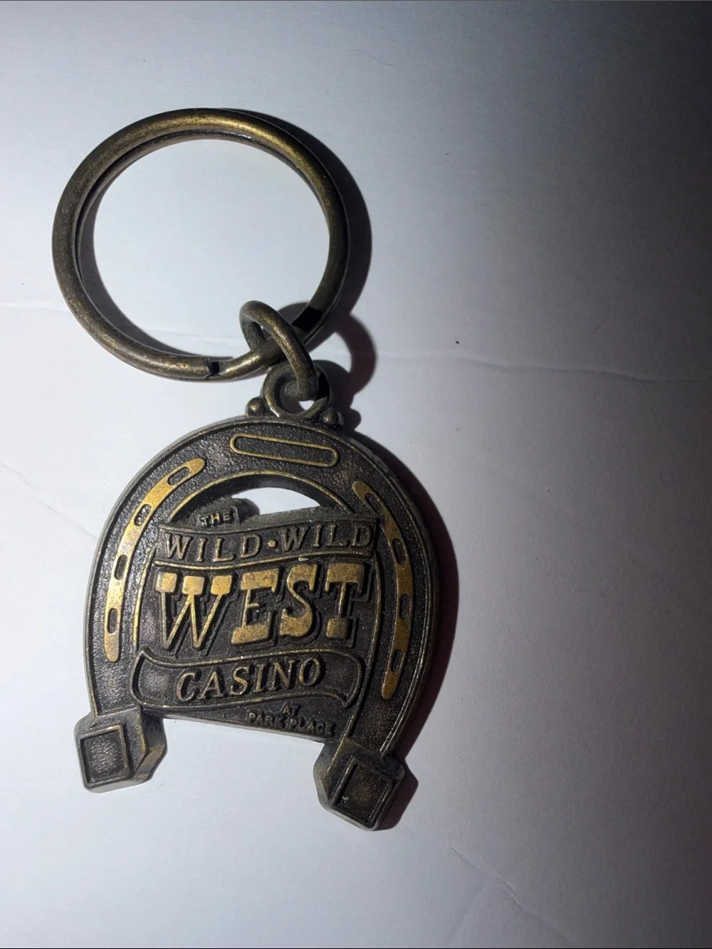 Wild Wild West Casino Las Vegas NV Horseshoe Metal Keychain Vintage Souvenir